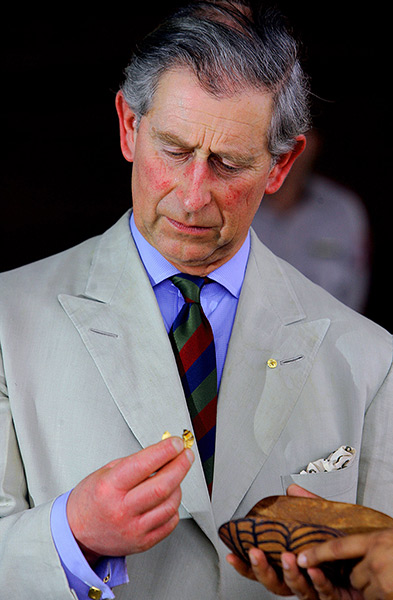 Charles's moments: Prince Charles studies a witchetty grub during a bush foods demonstration a