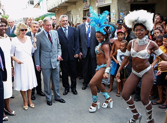 Charles's moments: Prince Charles and Camilla watch traditional Samba dancers perform during a