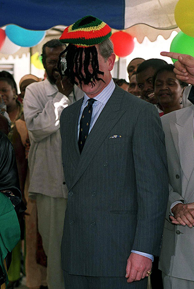 Charles's moments: Prince Charles is presented with a set of fake dreadlocks by Rita Marley on