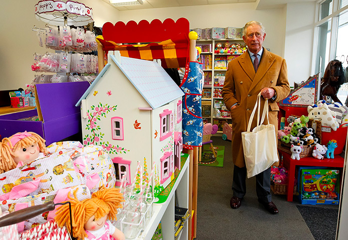 Charles's moments: Prince Charles looks around a toy shop in Poundbury 