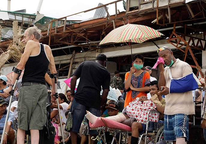 Haiyan aid: Injured passengers wait for a rescue airplane 