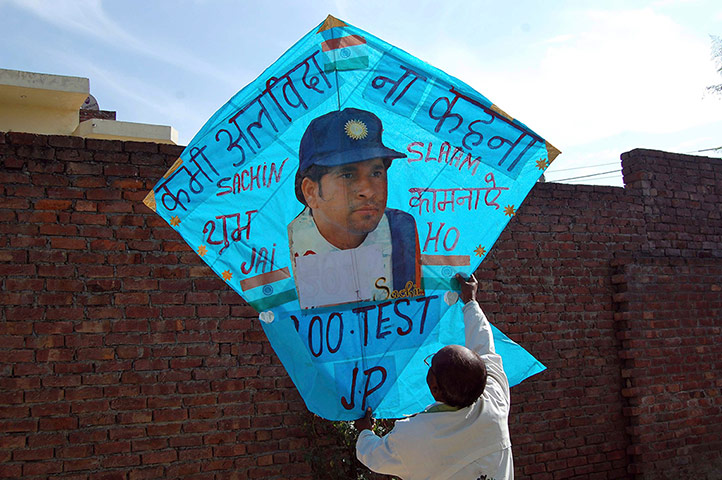 Tendulkar's last hurrah: Kitemaker Jagmohan Kanojia holds up a kite 