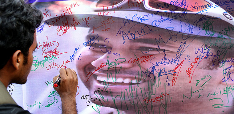 Tendulkar's last hurrah: A fan writes a message on Tendulkar's poster 