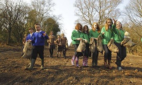 Children spread heather seeds