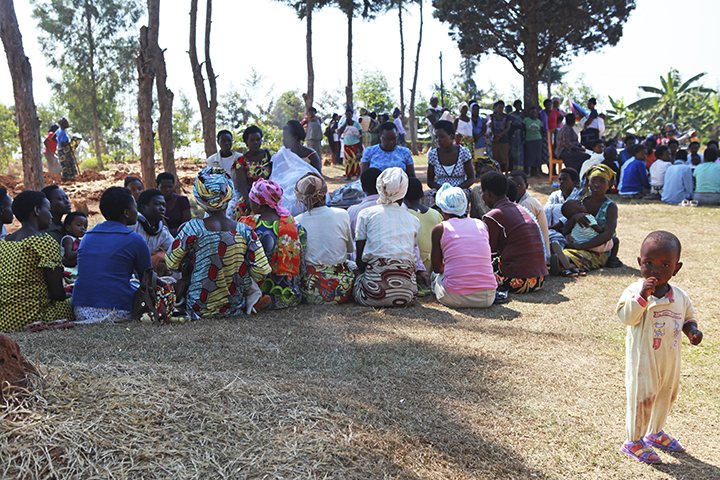 International Journalism: Women sit under trees while receiving training in Rwanda