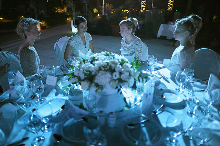 Weekend in pictures: Dubai, United Arab Emirates: Debutantes wait for the arrival of guests duri