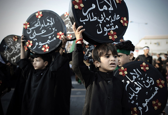 Weekend in pictures: Daih, Bahrain: Shia Muslim children take part in a religious procession marking Ashura