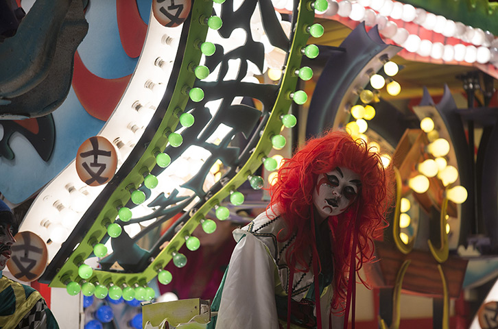 Weekend in pictures: Somerset, UK: A member of the British Flag Carnival Club takes part in the Glastonbury carnival 