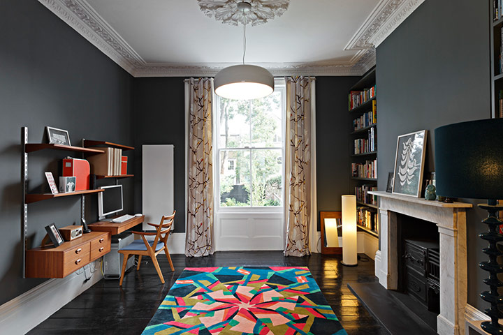 Homes - Lighten Up: living room with dark walls and multi-coloured rug