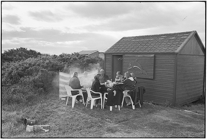 Elliott Erwitt: BBQ outside with coats on