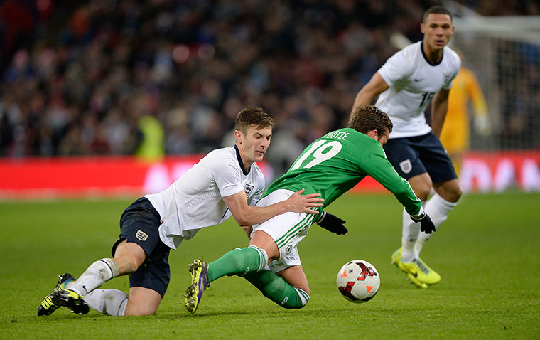 England and germany: Adam Lallana rugby tackles Mario Gotze 