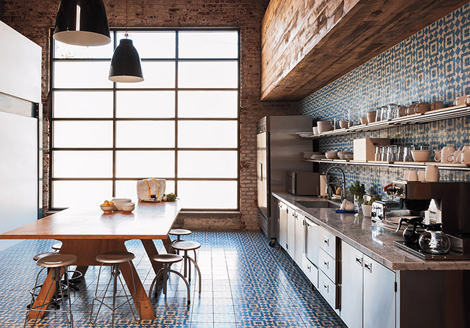 Homes - Remodelista: Kitchen and dining area with tiling and wooden table