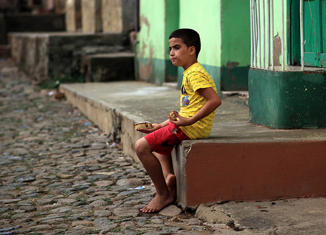 Your Pictures - Snack: boy sitting on step in Cuba
