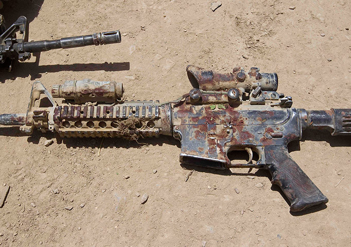Sgt Matt Krumwiede: A blood-covered M4 rifle belonging to Sgt. Matt Krumwiede