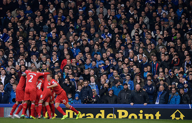 Merseyside derby: Everton fans look on silently as Liverpool players celebrate