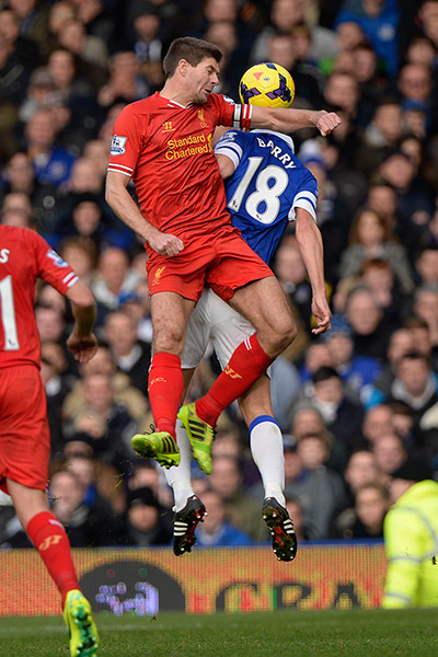 Merseyside derby: Steven Gerrard leads with his elbow in a header with Gareth Barry 