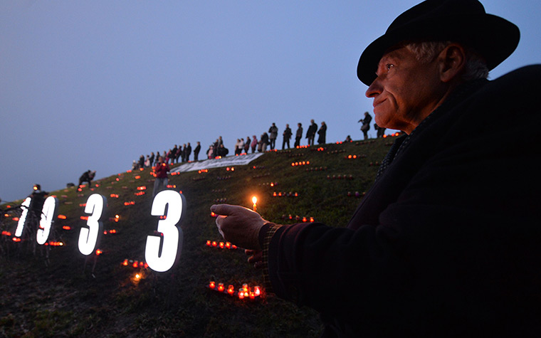 Weekend in pictures : Kiev, Ukraine: A man holds a candle in memory of the victims of the Holodom