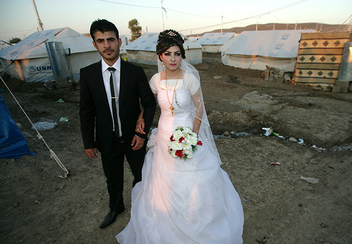 Weekend in pictures : Kurdish Iraq: Syrian-Kurdish refugees, Jvan Khaled, left, and his 18-year-o