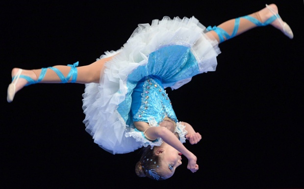 A young dancer from Slovakia shows off her agility competing in the preliminaries of the World Show Dance Championships in Riesa, Germany. 