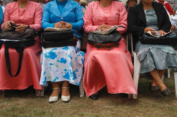 These women sitting with their bibles are attending the Worldwide Missionary Movement National Congress held at the San Marcos stadium in Lima, Peru. 
