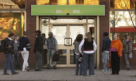 Job seekers queue at a Jobcentre 