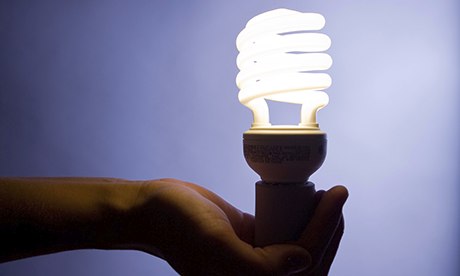 Hand holding a new Energy efficient Compact fluorescent lightbulb