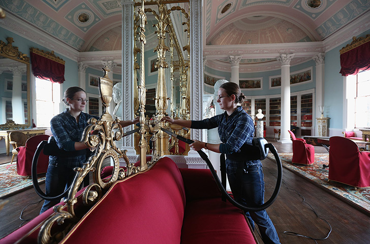 Kenwood House: Wendy Richardson, a member of the Conservation Team, cleans the gilded surr