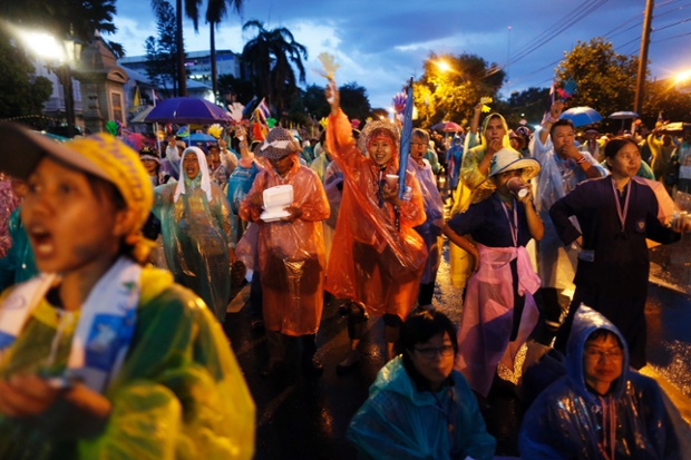 In Bangkok today the anti-government protest is a riot of colourful rainwear as demonstrators block the road outside the Interior Ministry in Bangkok.