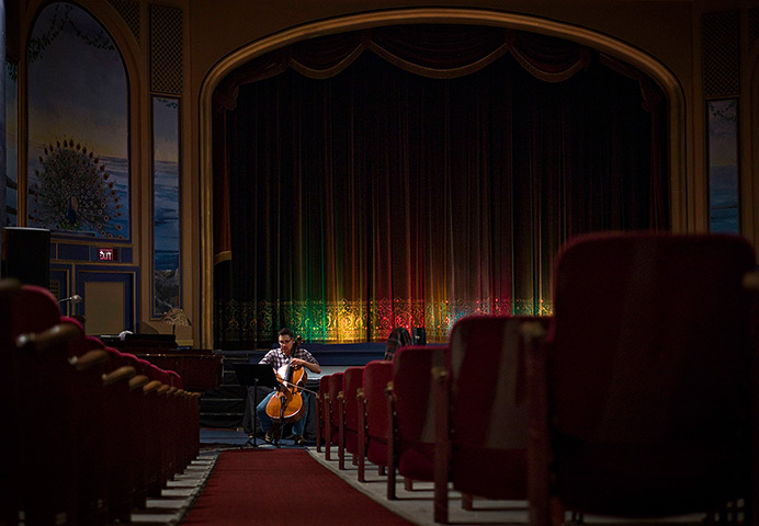Patricia Theatre: A local man rehearses on his cello for a Sunday afternoon concert 