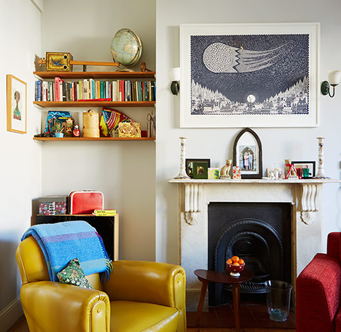 Homes - bold : colourful lounge with yellow armchair and cast iron fireplace