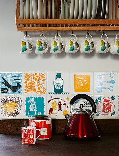 Homes - bold : red kettle with cups and tiles in background