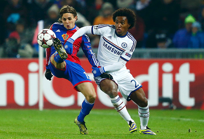 football: FC Basel's  Kay Voser challenges Chelsea's Willian