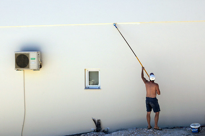 Your Pics - Decorate: man painting wall 