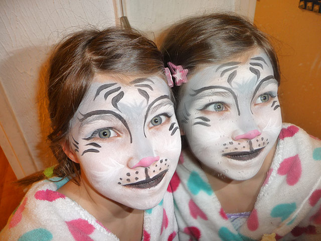 Your Pics - Decorate: girl with face painted reflected in mirror