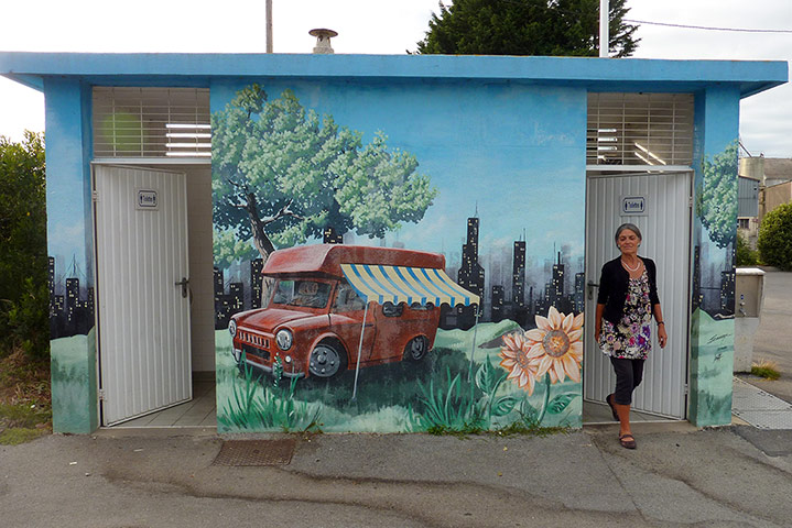 Your Pics - Decorate: woman in entrance of decorated toliets