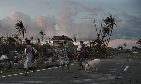 TOPSHOTS Typhoon victims walk along a ro