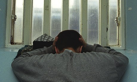 Young inmate looking depressed in prison cell, Portland Young Offenders Institution, Dorset