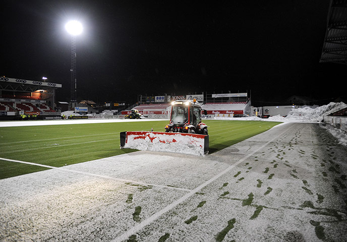 spurs: A tractor prepares the pitch