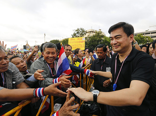 Thailand protests: Abhisit Vejjajiva greets anti-government protesters