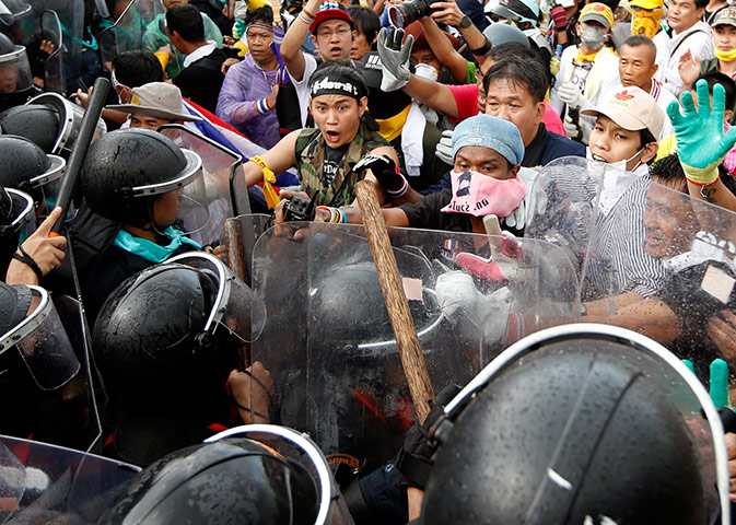 Thailand protests: Anti-government protesters scuffle with riot police