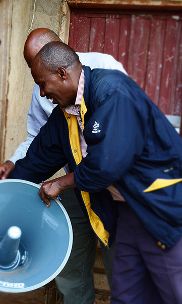 Malaria Consortium pics: speakerphone at a school