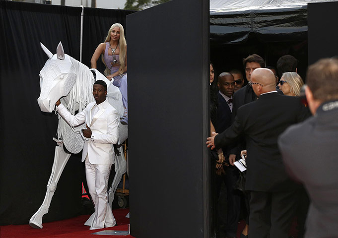 20 Photos: Lady Gaga arrives atop a horse puppet at the 41st American Music Awards