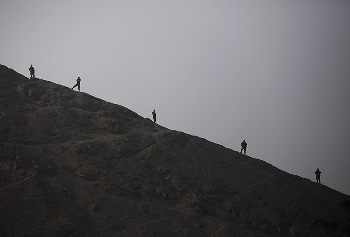 20 Photos: Anti-narcotics police officers guard a drug incineration in Lima