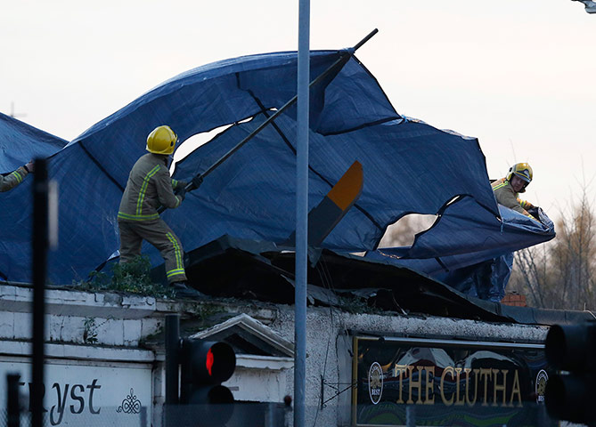 Clutha Bar: Rescue workers cover the wreckage