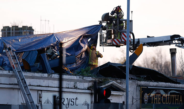 Clutha Bar: Rescue workers cover the wreckage
