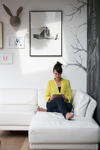 Homes - Homes for Heroes: owner Pia Fairhurst sits on white sofa of house