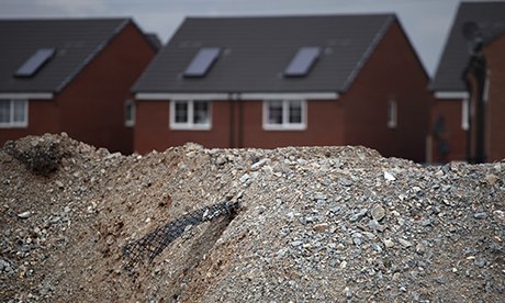 Construction material is seen in front of already completed homes 