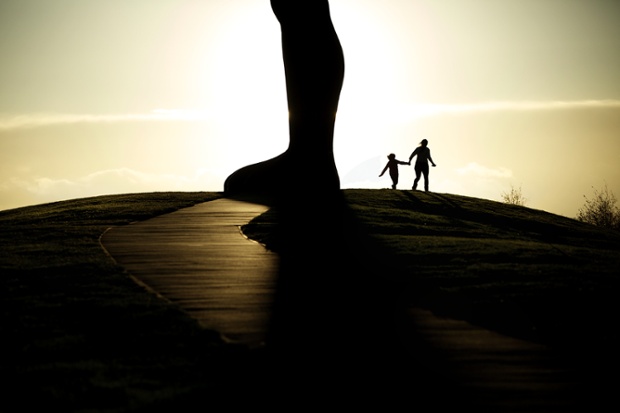 Visitors enjoy the last of the daylight as the sun sets over the Angel of the North, Antony Gormley's statue at Gateshead, Tyne and Wear. 