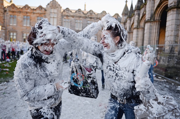 Students from St Andrew's University in Scotland indulge in a frothy tradition for Raisin Weekend. 