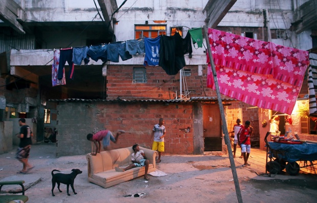Residents gather in a formerly deserted building which is currently home to 82 families in the port district of Rio de Janeiro.